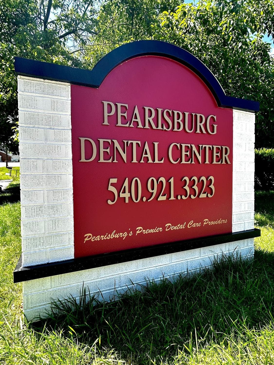 The Pearisburg Dental Center monument sign at the roadside, showing the practice name and the telephone number.